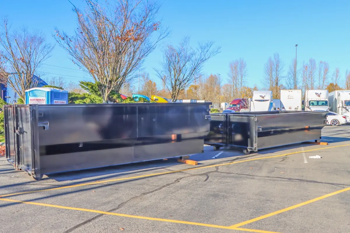 Professional dumpster rental service with roll-off container on residential driveway in Livermore